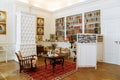 Horovice castle interior, Baroque chateau, library with bookshelves, carved wooden white furniture in the rococo style, old