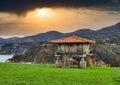 Horreo, typical hut in Asturias, next to La Regalina chapel, Cadavedo, Asturias, Spain