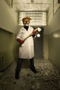 Serial murderer in creepy style of doctor clown on location of former hospital