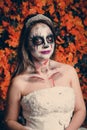 Horrible makeup on a girl in a bride dress for Halloween