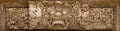 Horrible mythical monster face. Stone relief from Indonesia, Bali island Royalty Free Stock Photo