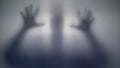 Horrible silhouette behind film, scary supernatural alien, strange creature