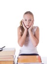 Horrified schoolgirl with pile of books