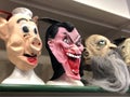 Horrifying carnival mask close-up in store. Vampire, pig and zombie masks. Halloween, carnival, masquerade costumes