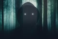 A horror concept of a hooded entity with glowing eyes. Overlayered of a spooky forest on a misty day in winter. With a blurred,