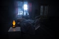 Man comfortably sleeping in his bed at night. A realistic dollhouse bedroom with furniture and window at night. Selective focus Royalty Free Stock Photo
