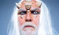 Horror with scary Halloween man. Vampire man with white eyes. Viking with a horned head. Demon head isolated on black Royalty Free Stock Photo