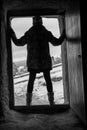 Horror Scene of a Woman Possessed with Blurry Head holding a doll at front door of an old house