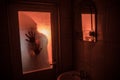 Horror silhouette of woman in window. Scary halloween concept Blurred silhouette of witch in bathroom. Selective focus