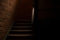 Horror style dark hall and stairs path way corridor indoor space and brick wall background in photography with lights and shadows