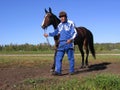 Horse auction demonstration of horses Novosibirsk Hippodrome man leads a horse