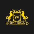 Initial Letter W Logo. Horse Brand Logo design vector. Retro golden crest with shield and horses. Heraldic logo template.