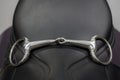 Horse bridle, snaffle on horse saddle Royalty Free Stock Photo