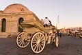 Horse carriage in Chania harbor at sunset, Crete