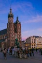 Horse with carriage in fronf of Basilica of Krakow at sunset in Poland