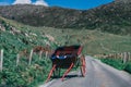 Horse carriage lies on the scenic road of Gap of Dunloe, a narrow mountain pass in county Kerry, Ireland on a sunny day Royalty Free Stock Photo