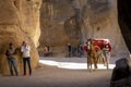 Horse carriage making it`s way through the Siq or Siqit, narrow gorge ending at Al Khazneh