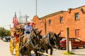 Horse carriage with two horses with USA national flag in the Fort Worth Stockyards, a historic district that is located in Fort Royalty Free Stock Photo