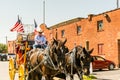 Horse carriage with two horses with USA national flag in the Fort Worth Stockyards, a historic district that is located in Fort Royalty Free Stock Photo