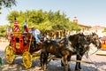 Horse carriage with two horses with USA national flag in the Fort Worth Stockyards, a historic district that is located in Fort Royalty Free Stock Photo