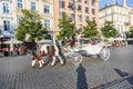 Horse carriages in front of Mariacki church on main square of Kr Royalty Free Stock Photo