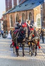 Horse carriages in front of Mariacki church on main square of Kr Royalty Free Stock Photo