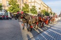 Horse carriages in front of Mariacki church on main square of Kr Royalty Free Stock Photo