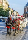 Horse carriages in front of Mariacki church on main square of Kr Royalty Free Stock Photo