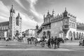 Horse carriages in front of Mariacki church on main square of Krakow Royalty Free Stock Photo