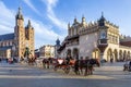 Horse carriages in front of Mariacki church on main square of Krakow Royalty Free Stock Photo