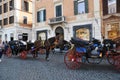 Horse carriages on the streets of Rome. Tourists take walks along the streets in beautiful carriages. Royalty Free Stock Photo