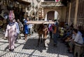 A horse carrying a wide load through the Fez medina in Morocco.