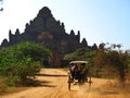 Horse cart approaching the Dhammayan Gyi Temple in Bagan Royalty Free Stock Photo