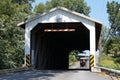 Horse cart approaching an old covered wooden bridge, Lancaster, PA, USA