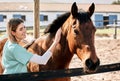 Horse doctor, care and smile at farm for health, care or happy with love for animal in nature. Vet, woman and stroke for Royalty Free Stock Photo