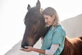 Horse doctor, care and smile outdoor at farm for health, care or happy with love for animal in nature. Vet, woman and Royalty Free Stock Photo