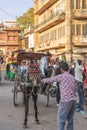 A horse-drawn carriage at the famous victorian Clock Tower market in the old blue city of Jodhpur Royalty Free Stock Photo