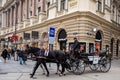 Horse-drawn carriage or fiaker, popular tourist attraction in Vienna, Austria Royalty Free Stock Photo