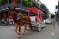 A horse drawn carriage through the French Quarter