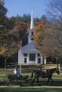 Horse drawn carriage outside of steeple church