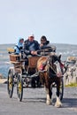 People in a horse drawn carriage, Inisheer, Aran island, Ireland