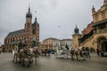 Horse drawn carriage in Rynek Glowny main square, Poland,