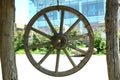 Horse-drawn carriage wheel . Wooden old horse-drawn carriage . The wheel of the horse-drawn carriage hung . Royalty Free Stock Photo