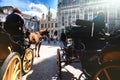 Horse-drawn carriages waiting for tourist tour. Bruges, Belgium