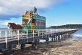 Horse drawn tram pulled by Clydesdale horse along the causeway from Granite Island to Victor Harbor Royalty Free Stock Photo