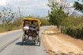 Horse drawn vehicle on a street in Cuba