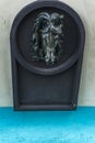 Horse drinking trough with the sculpture of the head of a horse over it Royalty Free Stock Photo