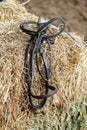 Horse equipment on a fresh bricks of hay Royalty Free Stock Photo