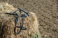 Horse equipment on a fresh bricks of hay Royalty Free Stock Photo