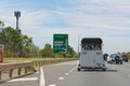 Horse float on busy highway.